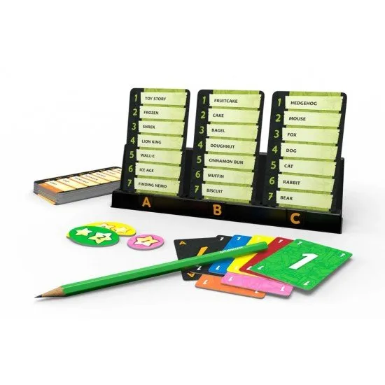 A chaotic tabletop scene with drawing boards, colourful markers, and cards featuring various similar words