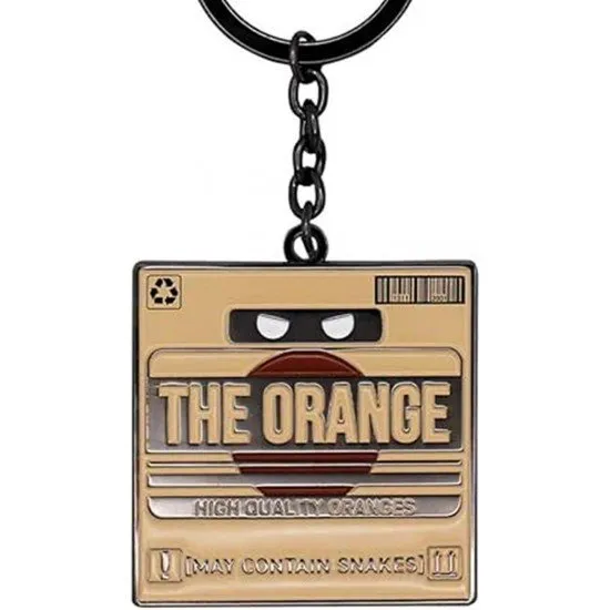 Metal keyring shaped like The Orange cardboard box from Metal Gear Solid 2 with shipping labels