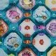 Colourful coral reef tiles and sea-life tokens arranged on a table to show a developing underwater habitat