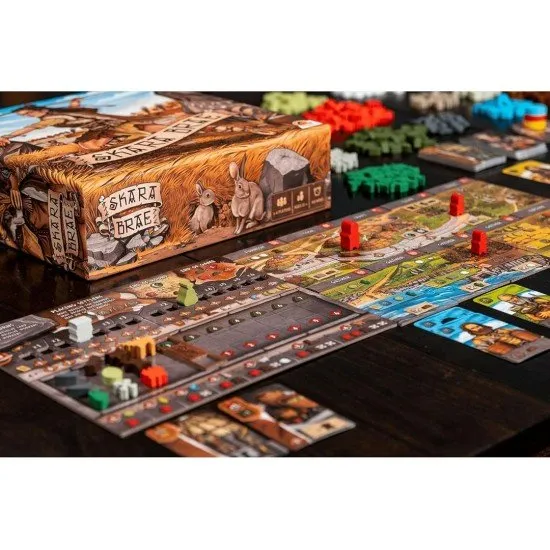 The box art for the Skara Brae board game, showing ancient stone houses and a community of settlers on the Orkney Islands.
