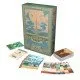 An Earthborne Rangers expansion card box featuring beautiful eco-fantasy artwork of a thriving, verdant valley community surrounding a large spire structure