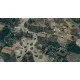 A high-altitude strategic view of a massive tank division advancing through a war-torn European village