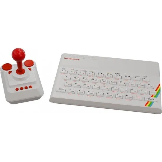 A white ZX Spectrum computer with a matching 8-button joystick and a CRASH magazine