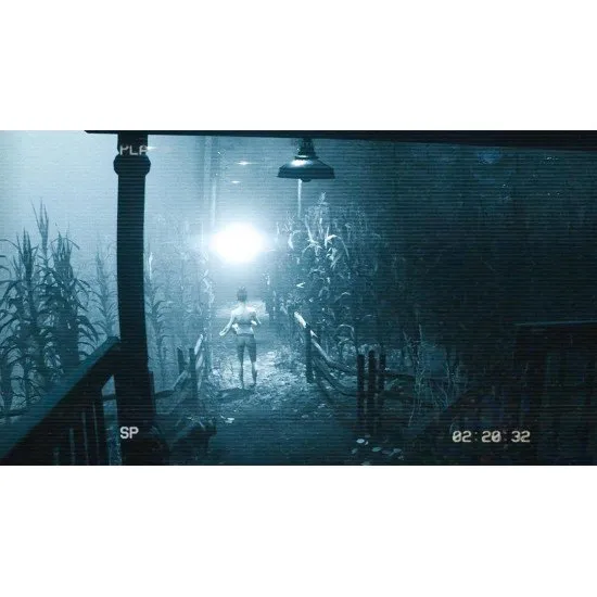 A cinematic view of a dark, isolated farmhouse illuminated by a mysterious light from the night sky