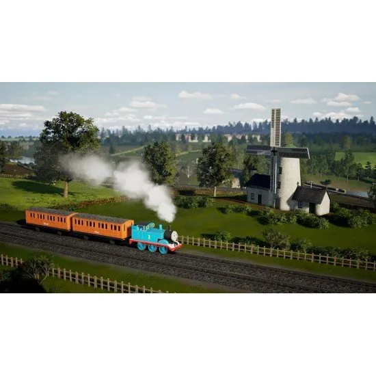 Thomas the Tank Engine pulling Annie and Clarabel past the iconic Tidmouth Sheds