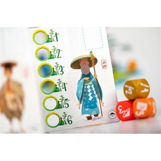 Tokaido Duo game board and components featuring colorful character pieces for the pilgrim, merchant, and artist on a map of Shikoku