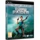A PC game box display showing Lara Croft standing confidently under a sunbeam shining through a ruined skylight, holding a detailed ancient map