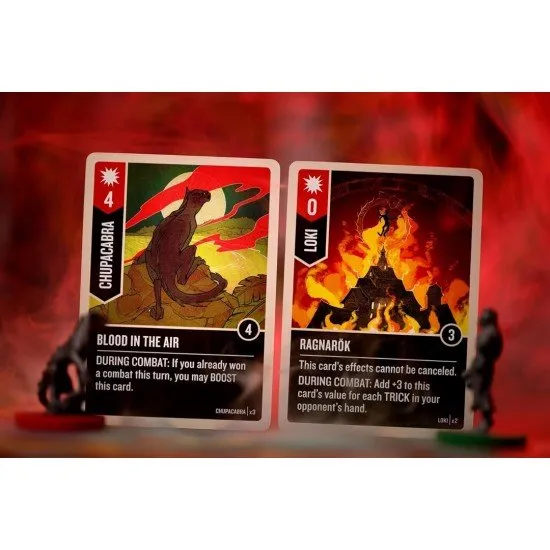 Four highly detailed character miniatures standing on a stylised circular battlefield board with vibrant card art in the background