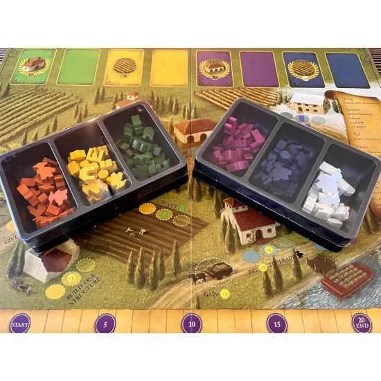 A scenic game board depicting a sun-drenched Italian estate with wooden worker meeples and glass grape tokens