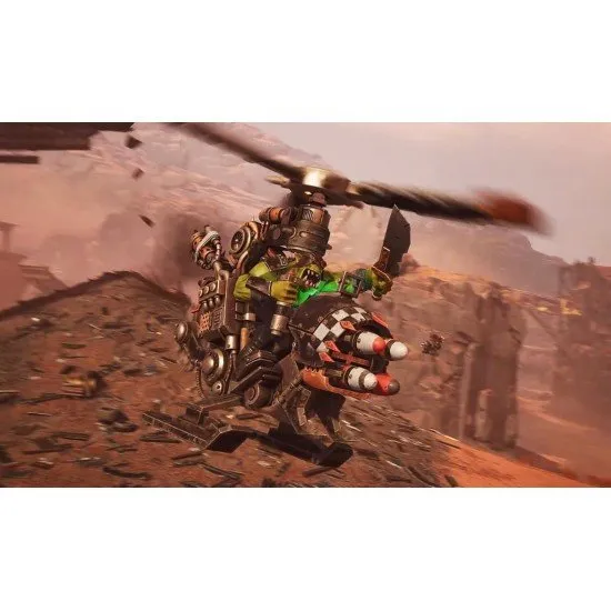 Orky buggies and tanks racing through a war-torn desert track with explosions in the background