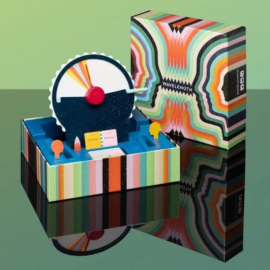 A large circular plastic dial with a sliding red screen and a pointer used for guessing spectrums