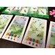 Colourful bird cards featuring a Bee Hummingbird and a Snowy Albatross on a vibrant game mat
