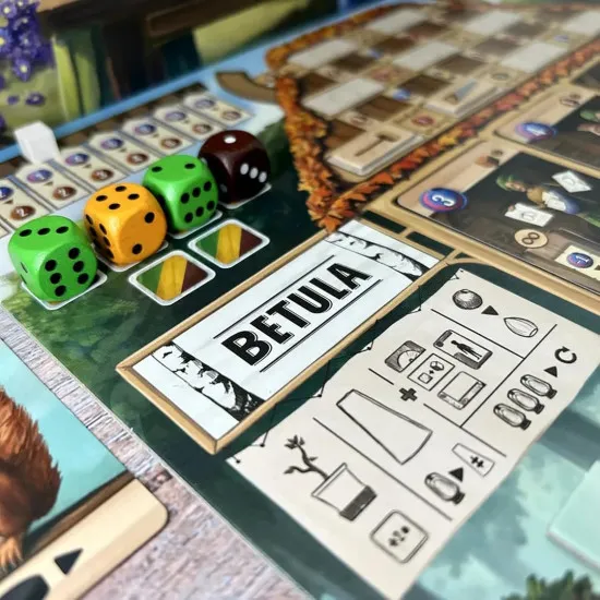 Box art for Woodcraft board game showing forest folk crafting wooden items in a woodland workshop