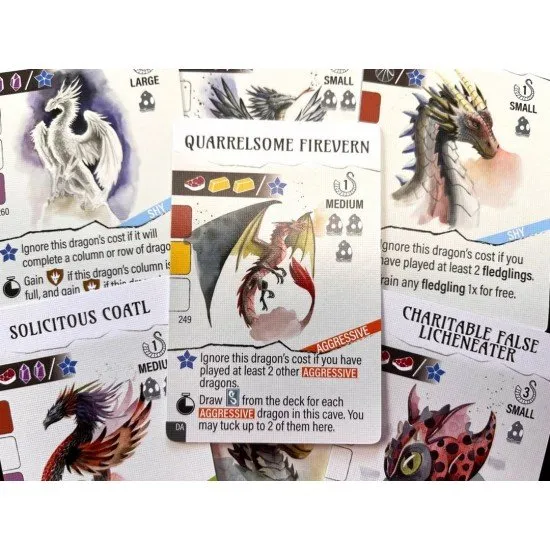 A colourful array of new dragon cards and cave tiles featuring whimsical watercolours of young dragons in a school setting